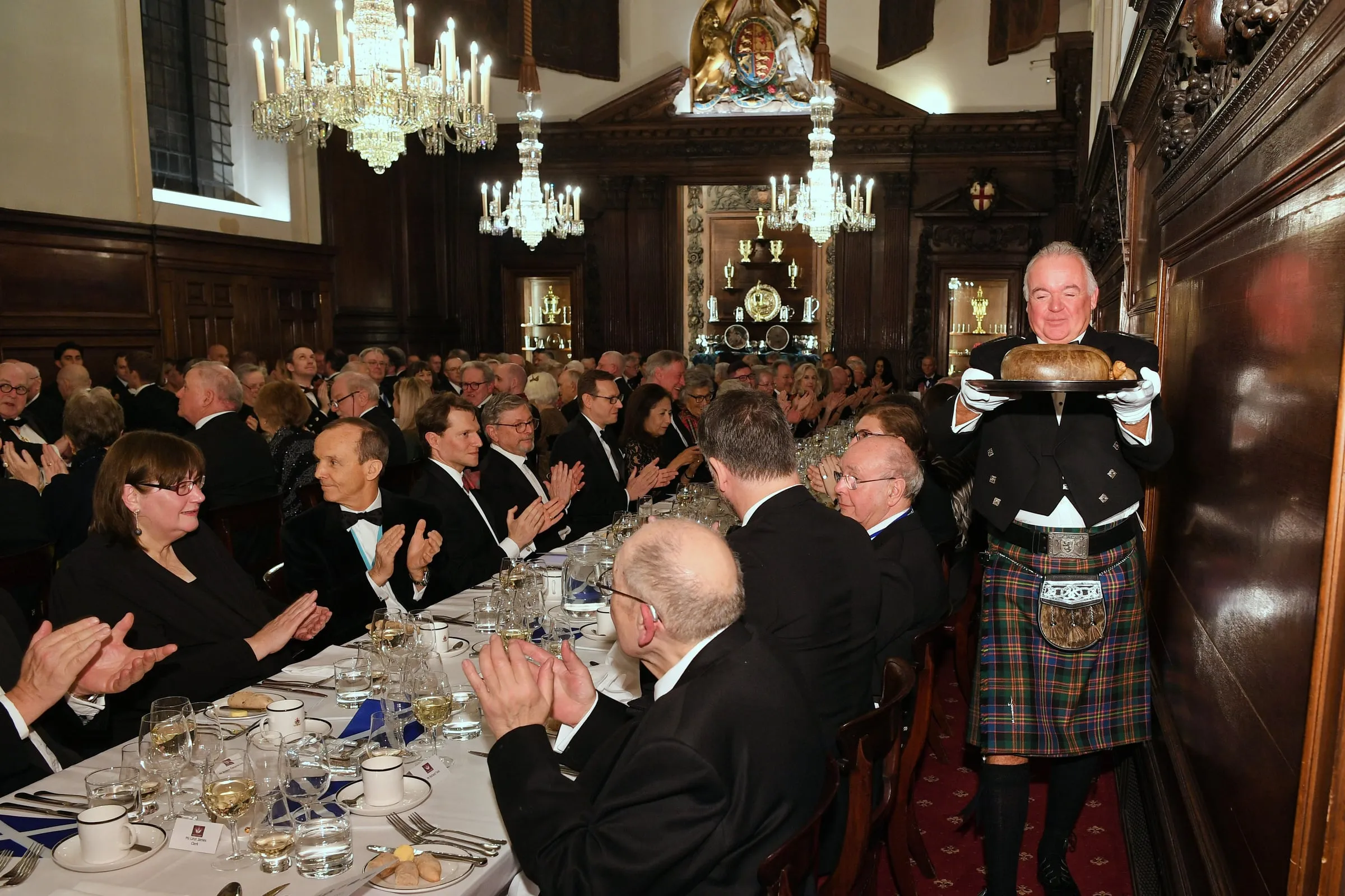 Guests at a Distillers’ Burns Night dinner in Vintners’ Hall as the haggis is presented.