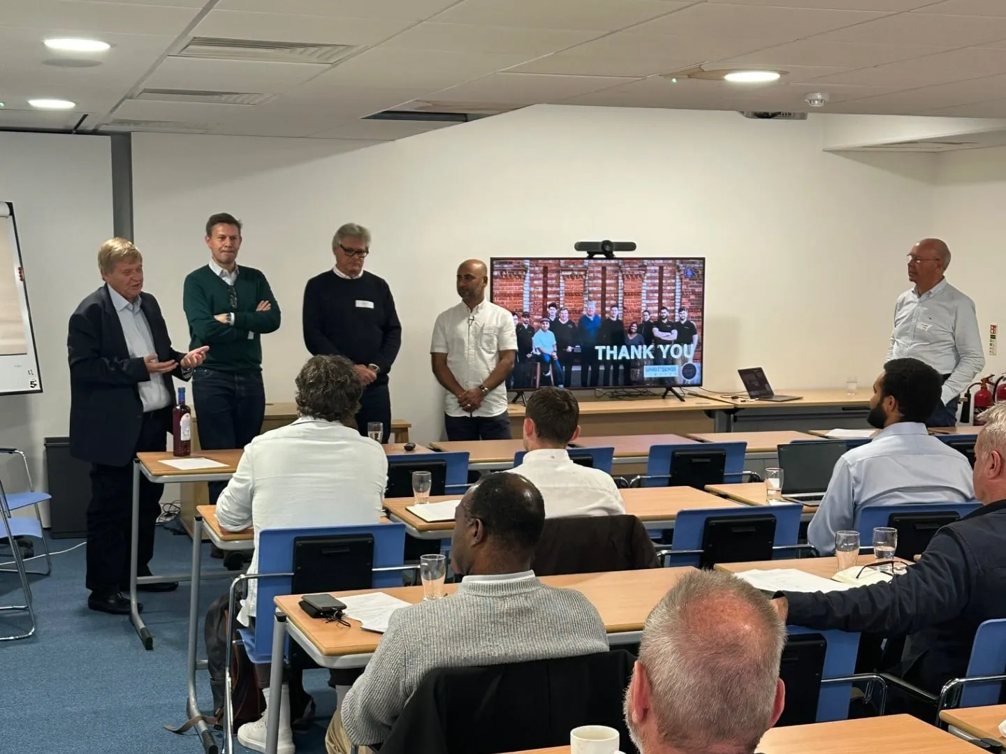 Speakers addressing students in a Business of Spirits classroom seminar.