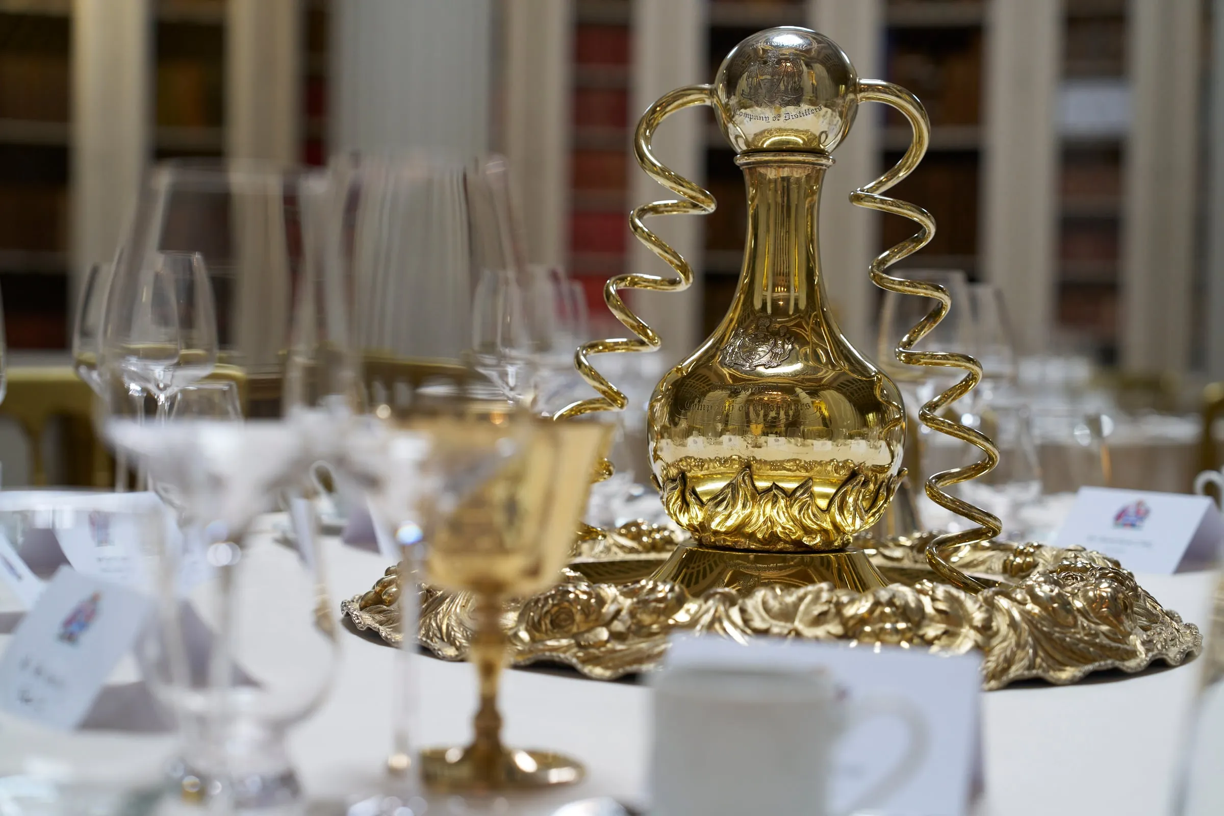 Company ceremonial silver on a dining table at a Distillers’ occasion.