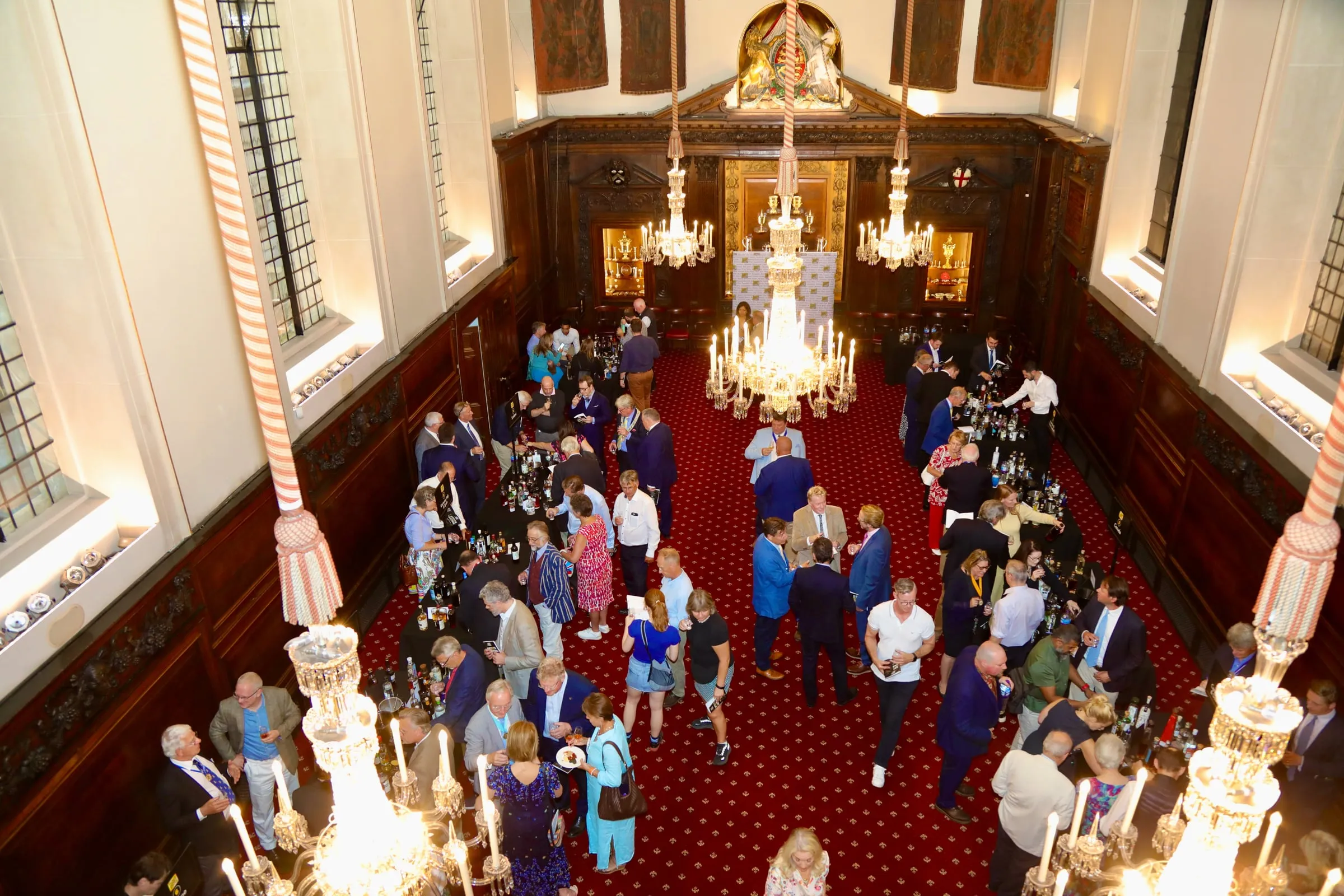 Members gathering for drinks in a livery hall before a Company occasion.