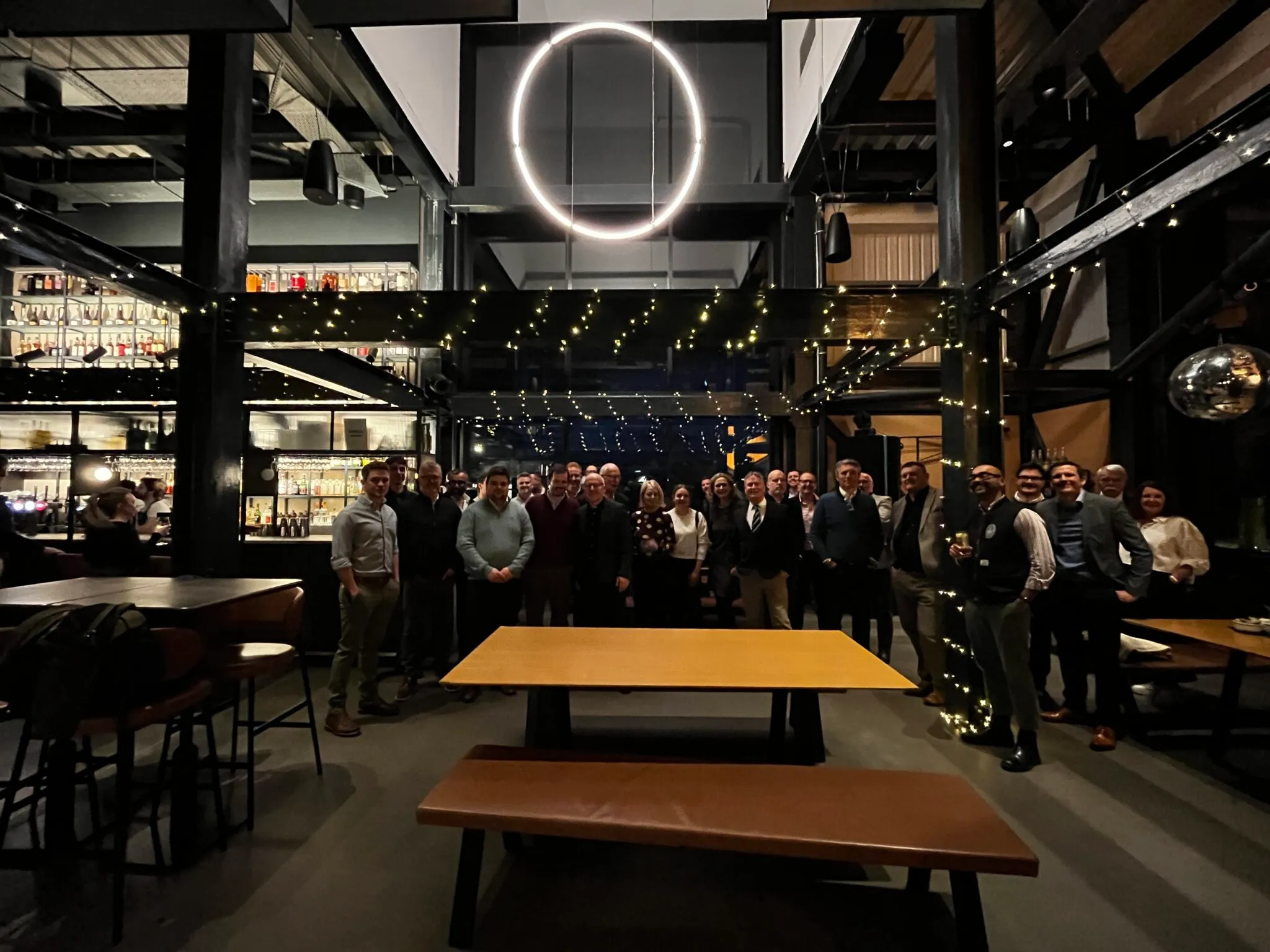 The group under a ring light in the Port of Leith Distillery bar