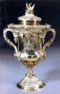The Company’s Loving Cup, a covered silver-gilt cup with vine ornament, two handles and a bird finial.